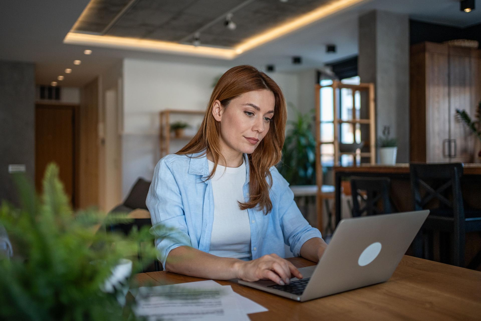 Focused freelancer working remotely from home office